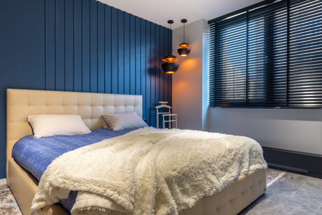 Bedroom with dark window blinds